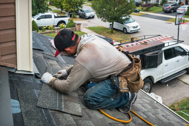 Professional Roof Replacement technician working in Montgomery, VT
